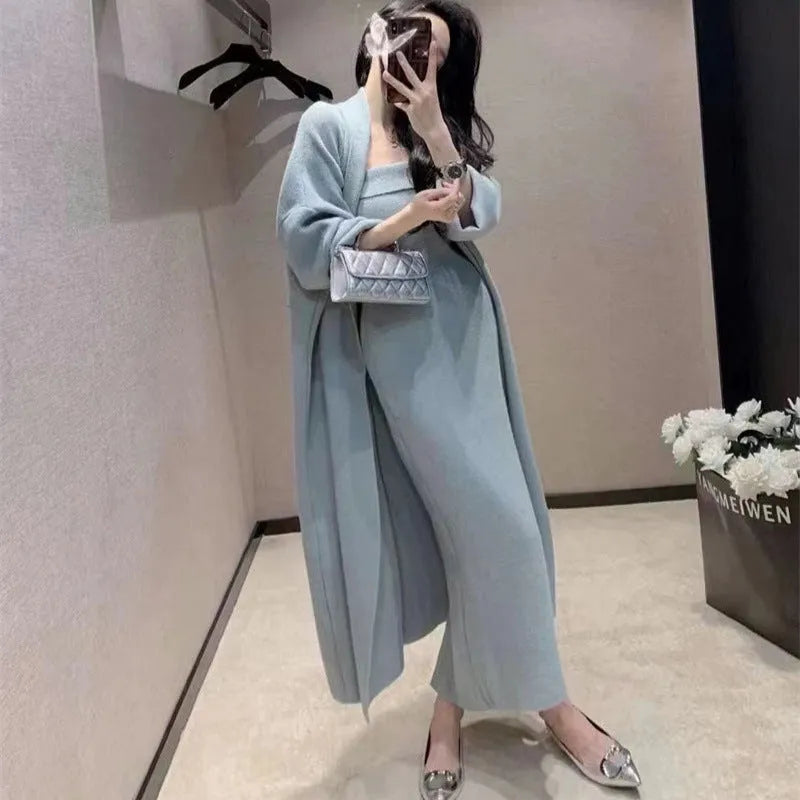 Women's grey knitted long-sleeve dress and matching cardigan set laid flat.