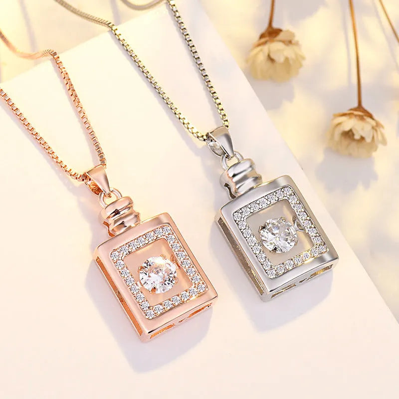 Sterling silver heart necklace with crown detail on a 45 cm chain, shown in silver and rose gold finishes.