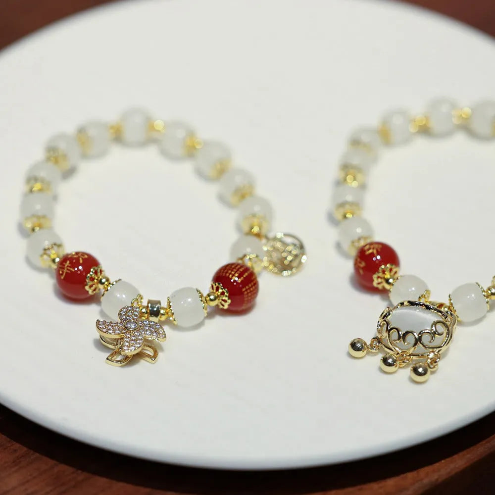 Women's Chinese style glass bracelet with safety lock, fu character, windmill, bamboo, and jade charm elements