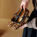 Black women's square toe stiletto heel ankle-strap shoes with a textured horse hair upper.