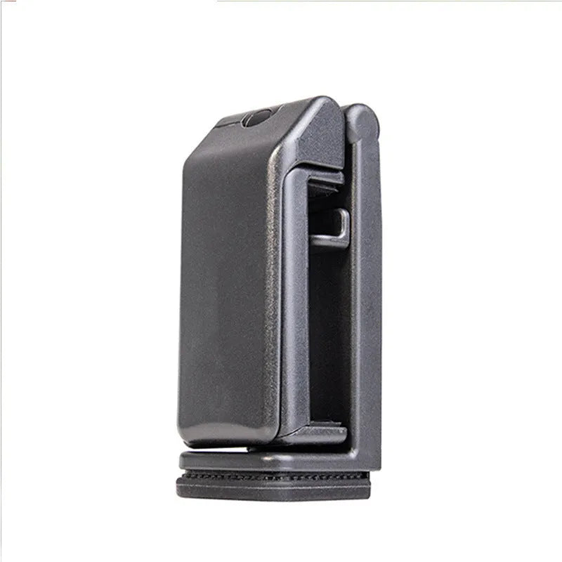 Black foldable ABS phone holder with 360-degree rotation on a desk next to a smartphone