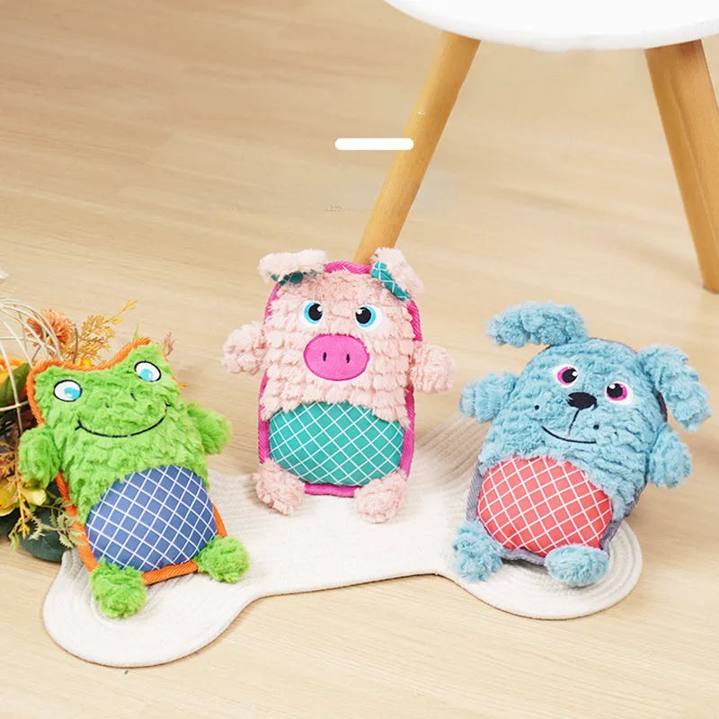 Blue bite-resistant stuffed dog toy with squeaker, safe for molar teeth, next to green and pink versions.