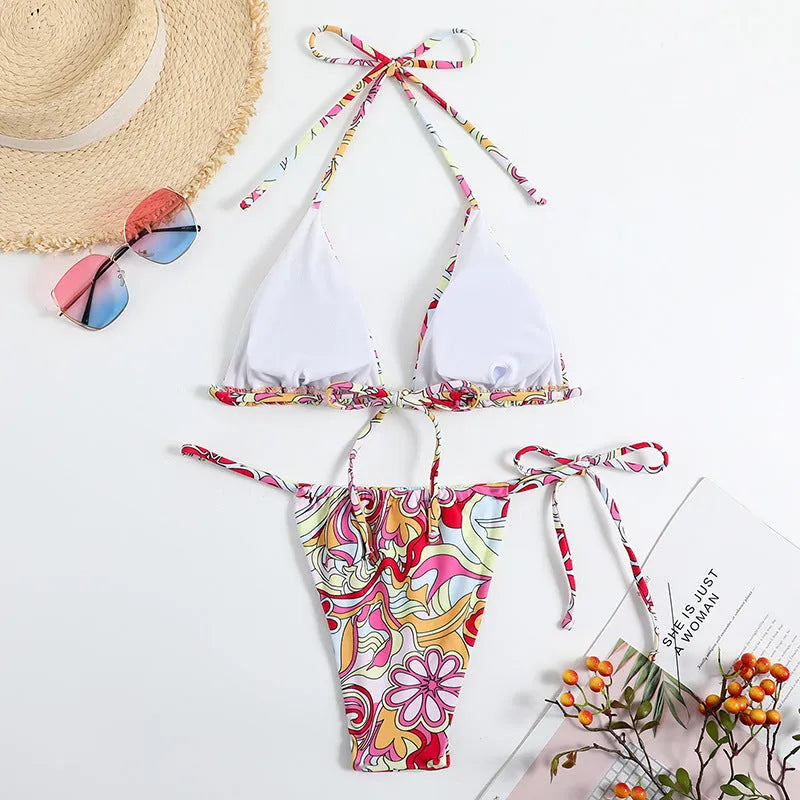 Women's triangle print bikini set with halter neck top and separate bottoms in multicolour pattern