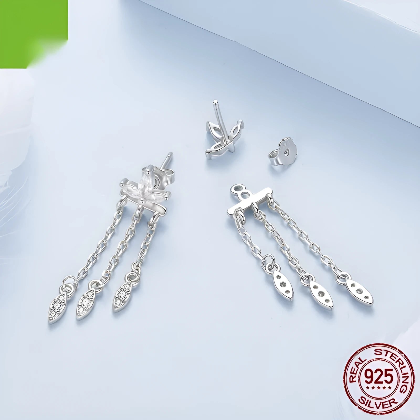 Pair of silver ear studs with small flower and tassel front and rear structure, BSE1240 colour, on light background