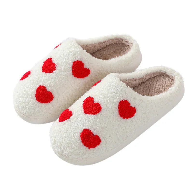 Women's plush cartoon love style slippers with a PVC sole in multiple colour options.