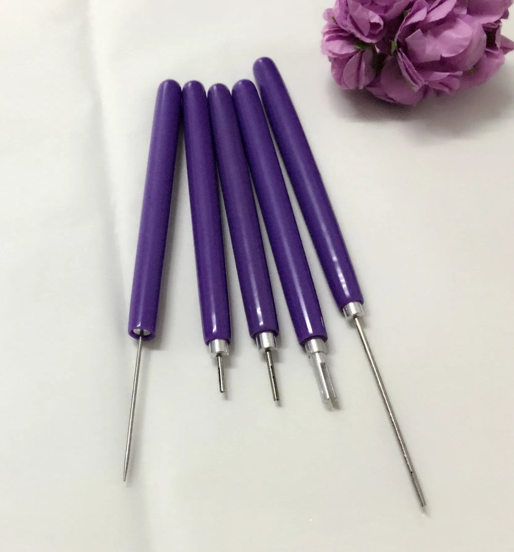 Purple quilling paper tool set with five slotted pens and needle stylus on white background