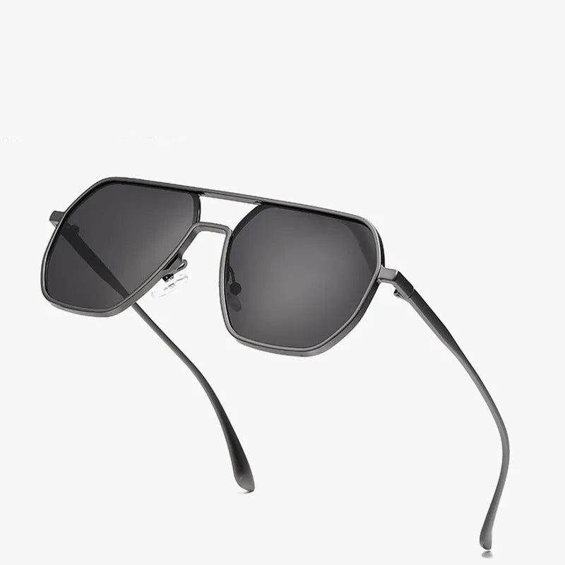 Men's polarised driving sunglasses with irregular frame in black, gold, or gunmetal colour options.