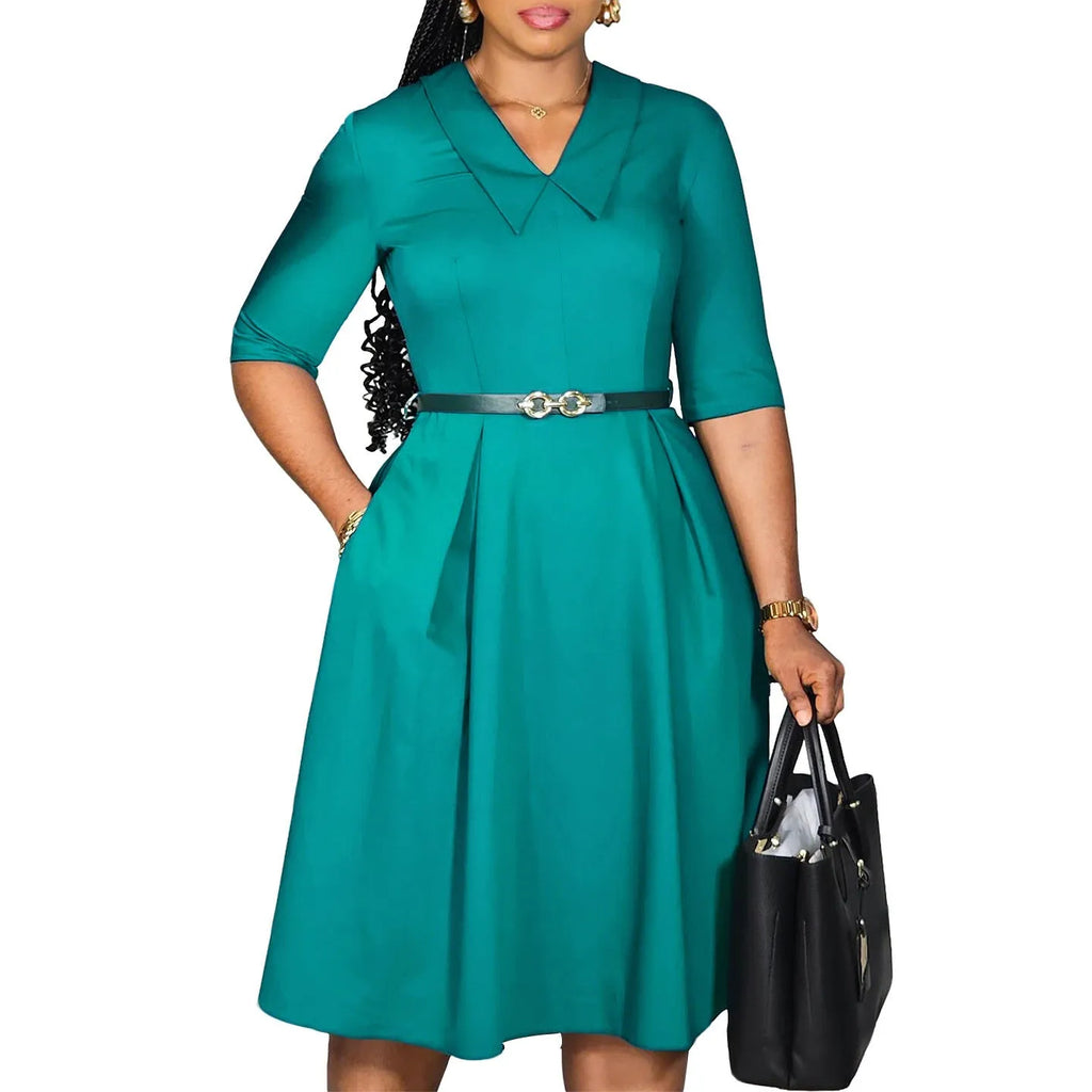 Women's solid colour African dress with high waist and matching belt in polyester fabric.