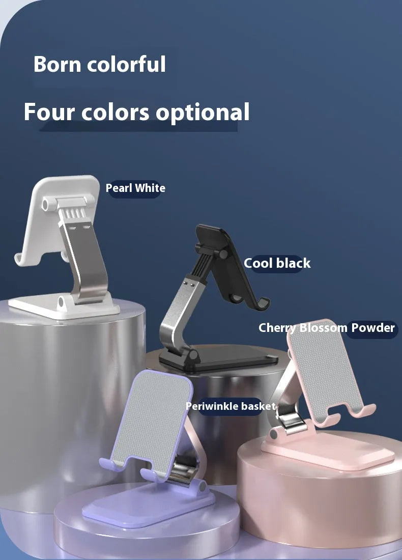 Foldable aluminium alloy phone holder in black on a wooden desk with a smartphone propped up for viewing