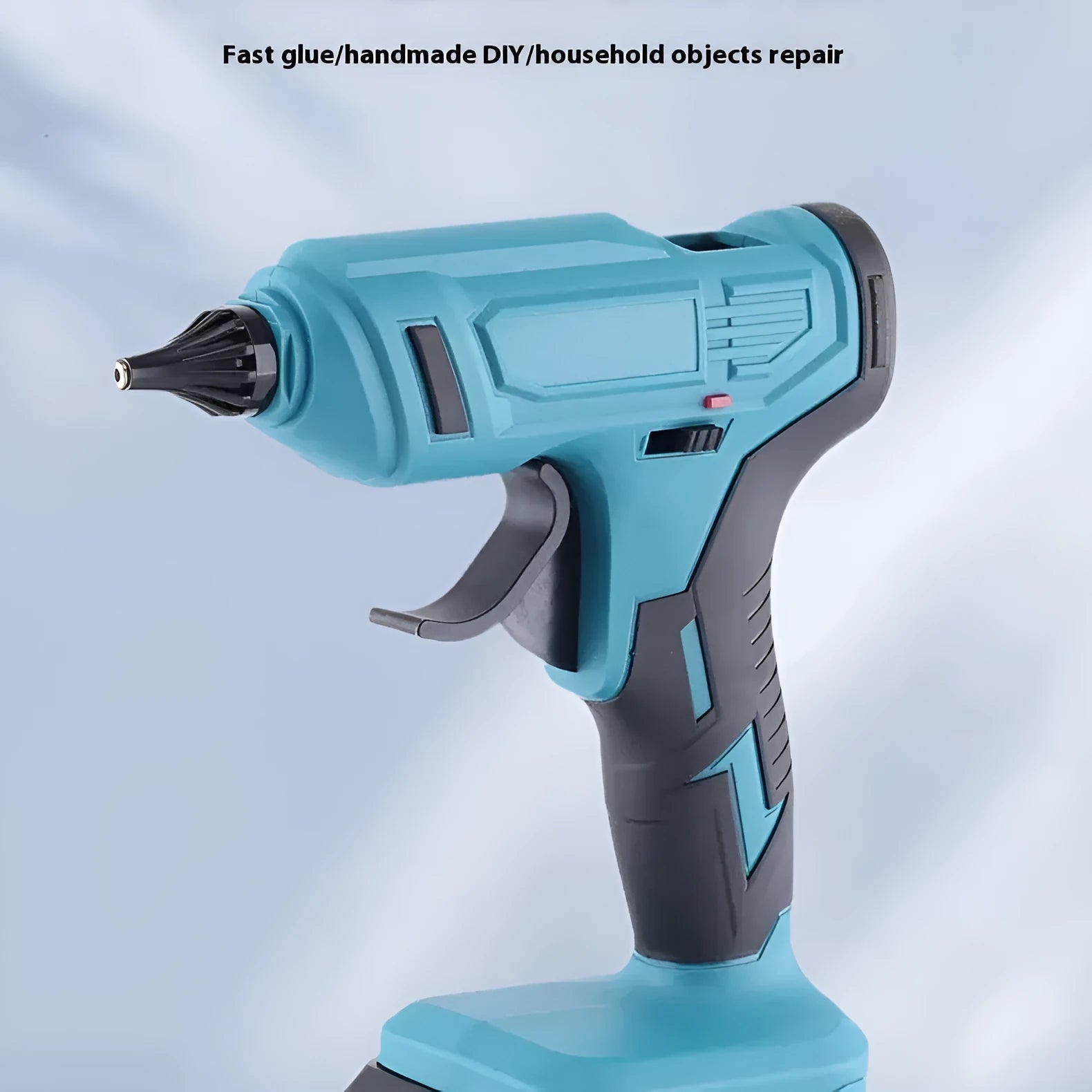 Rechargeable hot melt glue gun with lithium batteries and glue sticks on work surface