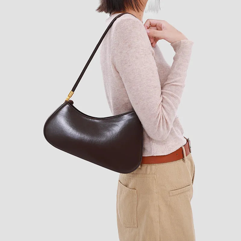 Retro oval women's underarm bag in seven colour options with single shoulder strap and sandwich pocket