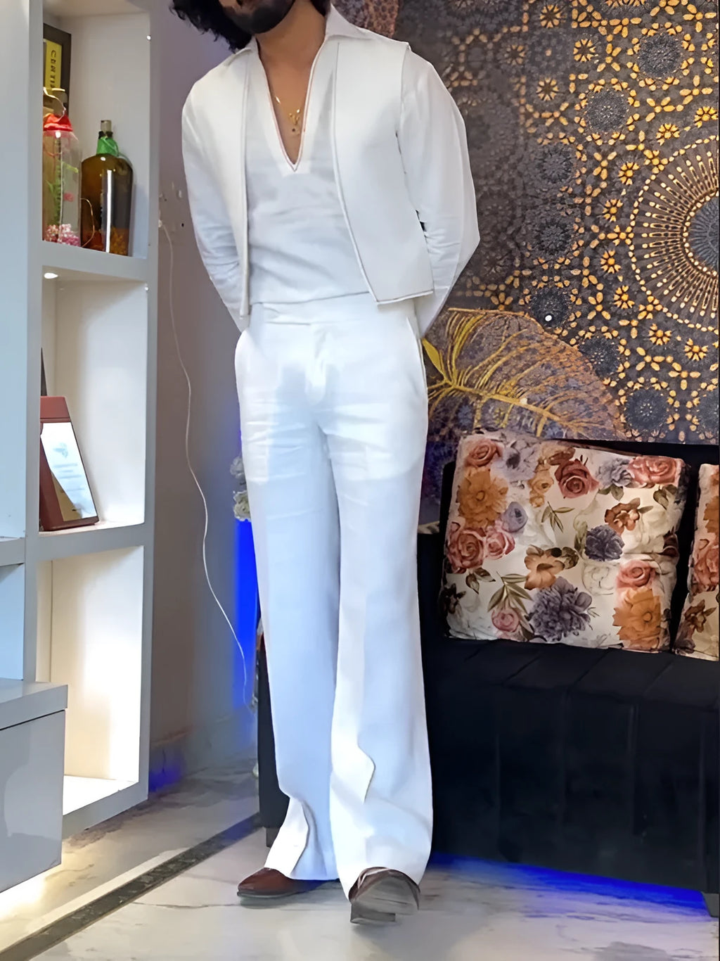 White three-piece women's outfit with V-neck shirt, sleeveless vest, and full-length trousers