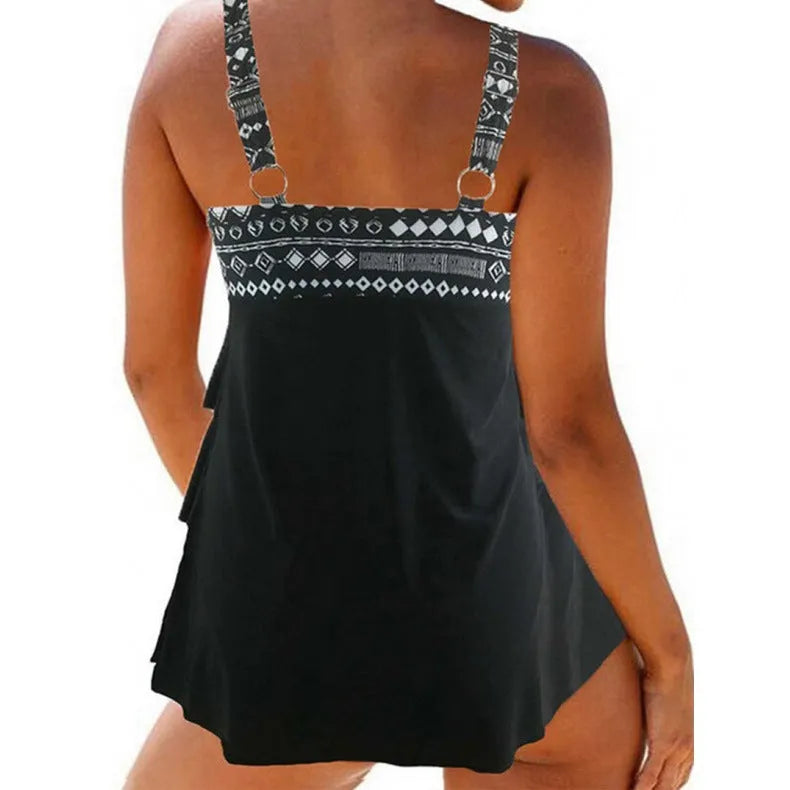 Women's plus size blue split swimsuit with double shoulder straps and a bow detail.