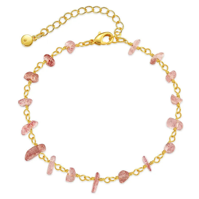 Geometric women's copper bracelet with irregular turquoise gravel stones and crystal accents on a white background.