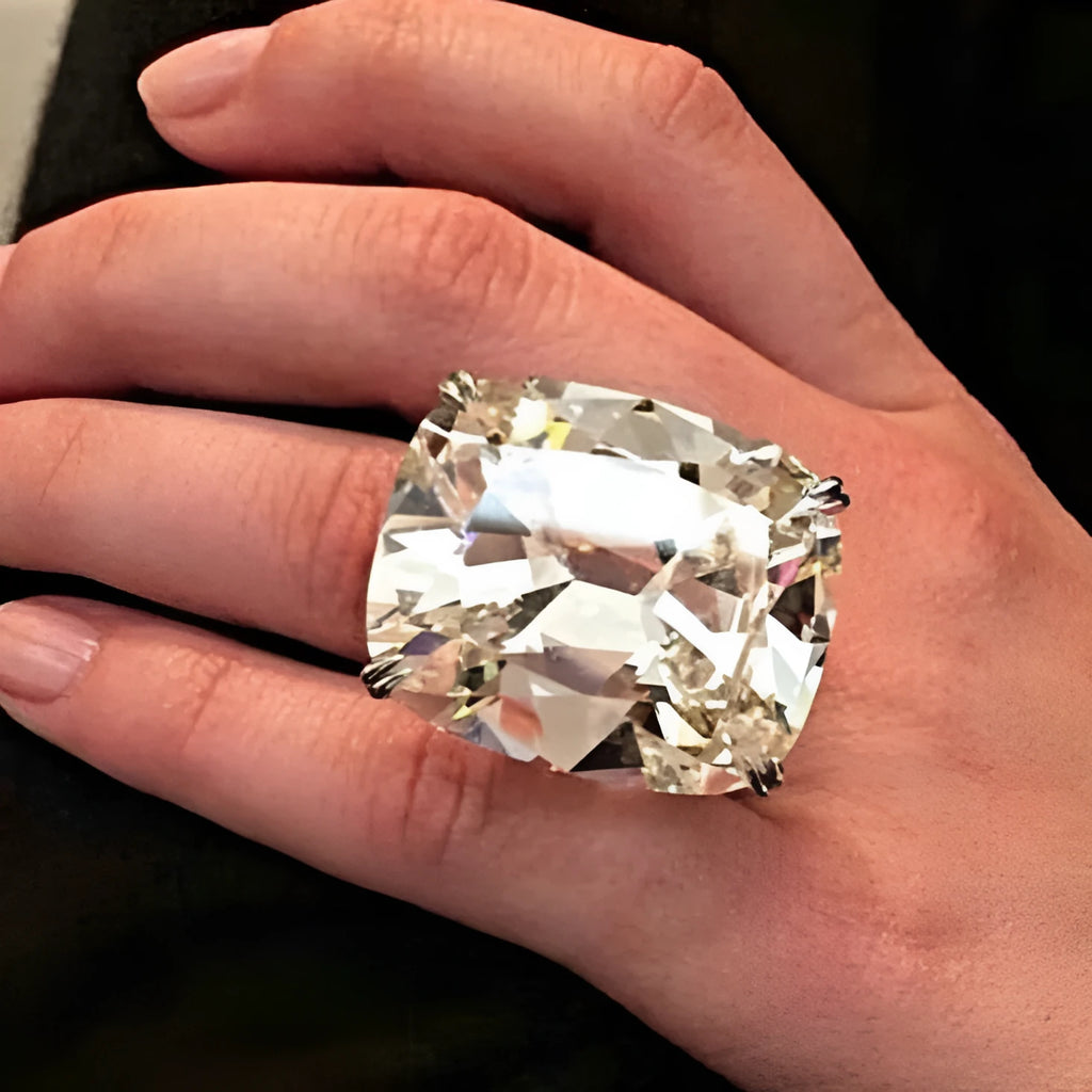 Women's square diamond ring with electroplated white gold colour and geometric design showing inlaid white stones