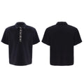 Men's black polo t-shirt with square collar, short sleeves, and heavy embroidery sequin decoration