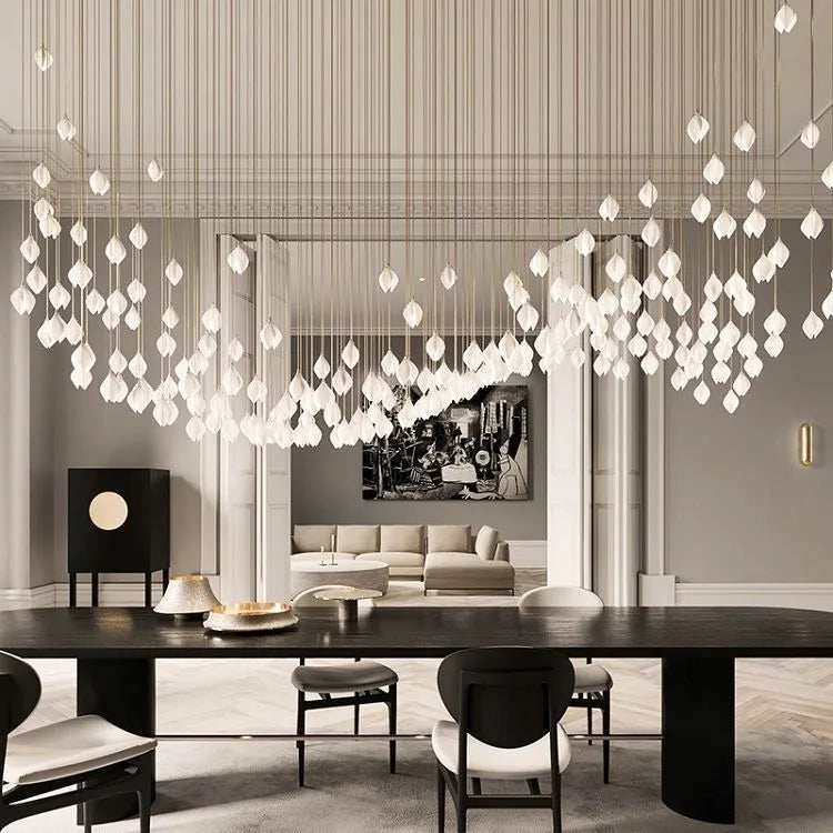 Ceramic magnolia petal shaped single pendant light with minimalist design.