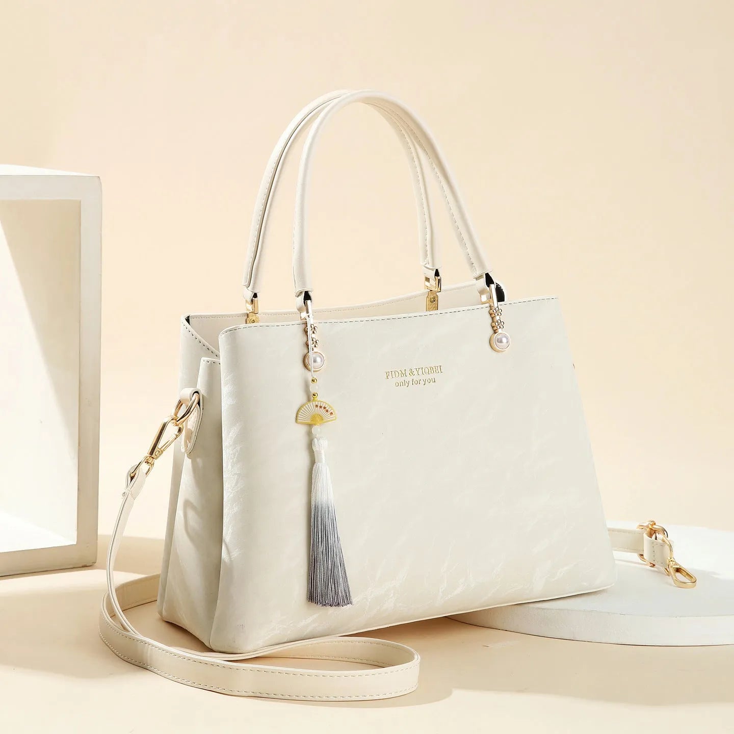 Women's PU leather shoulder bag with horizontal square shape and slit pockets in ethnic-style finish