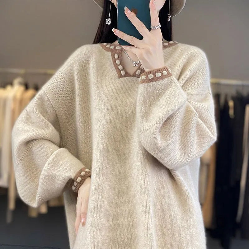 Women's white V-neck viscose pullover sweater showing long sleeves and regular fit.