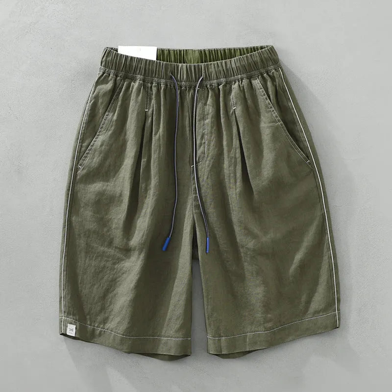 Men's loose straight leg linen shorts in green with drawstring waist and mid thigh length