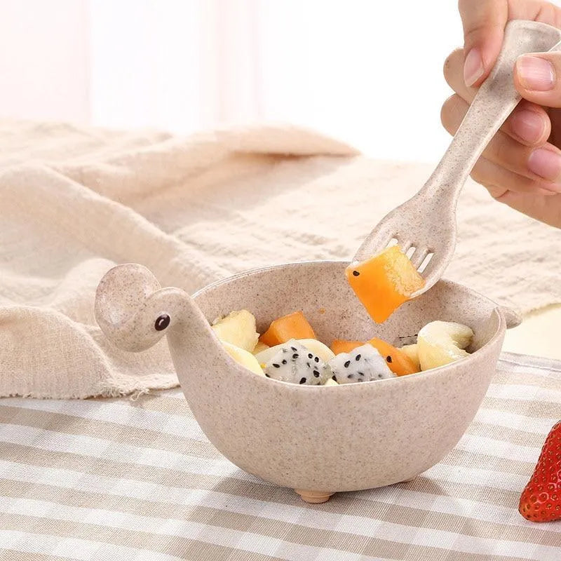 Cute tiny dinosaur bowl made of natural wheat straw fibre in pink, green, and beige colours, lightweight non-slip unbreakable design