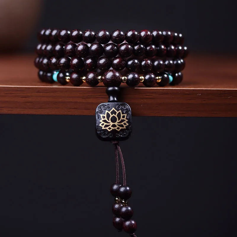 Zambia Rosewood 108-bead bracelet with flat lotus pendant on neutral background