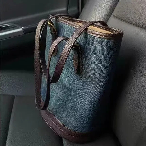 Denim patchwork handbag with retro bucket design showing dimensions and one-shoulder strap