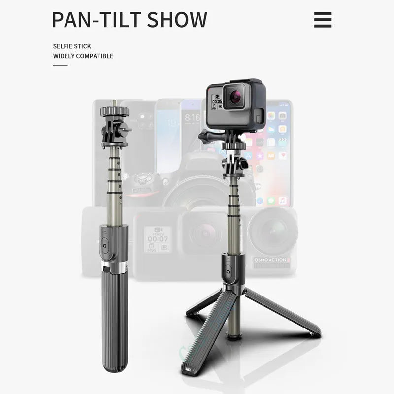 Black aluminium selfie stick with tripod base extended to mid-length next to an iPhone.