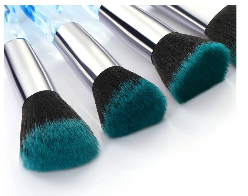 Set of ten clear crystal handle makeup brushes with diamond shank detail and artificial fibre bristles.