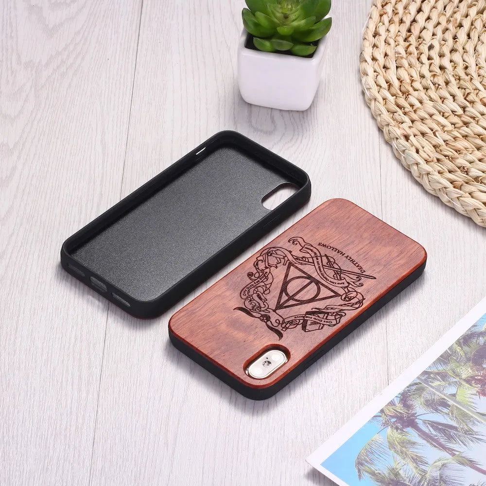 Wooden phone case with laser-carved design on a wooden back and a black TPU frame.