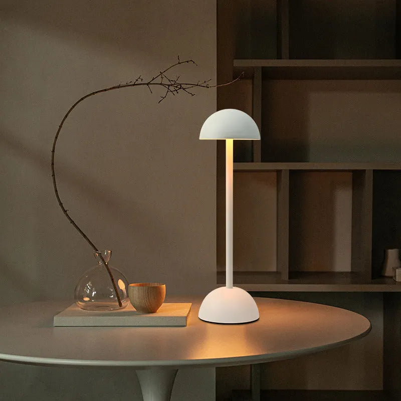 Creative high foot metal mushroom table lamp in white with Type-C power cable on a bedside table