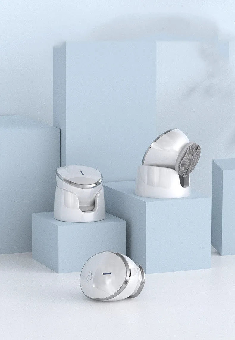White multifunction USB charging facial cleansing massager with hot egg design, silicone brush head, and 5 vibration modes on a white background