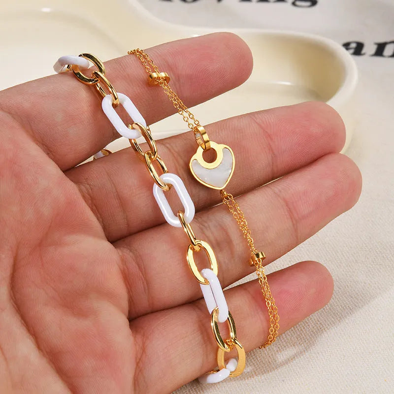 Women's ins style stainless steel bracelet with a double-layered electroplated resin heart charm