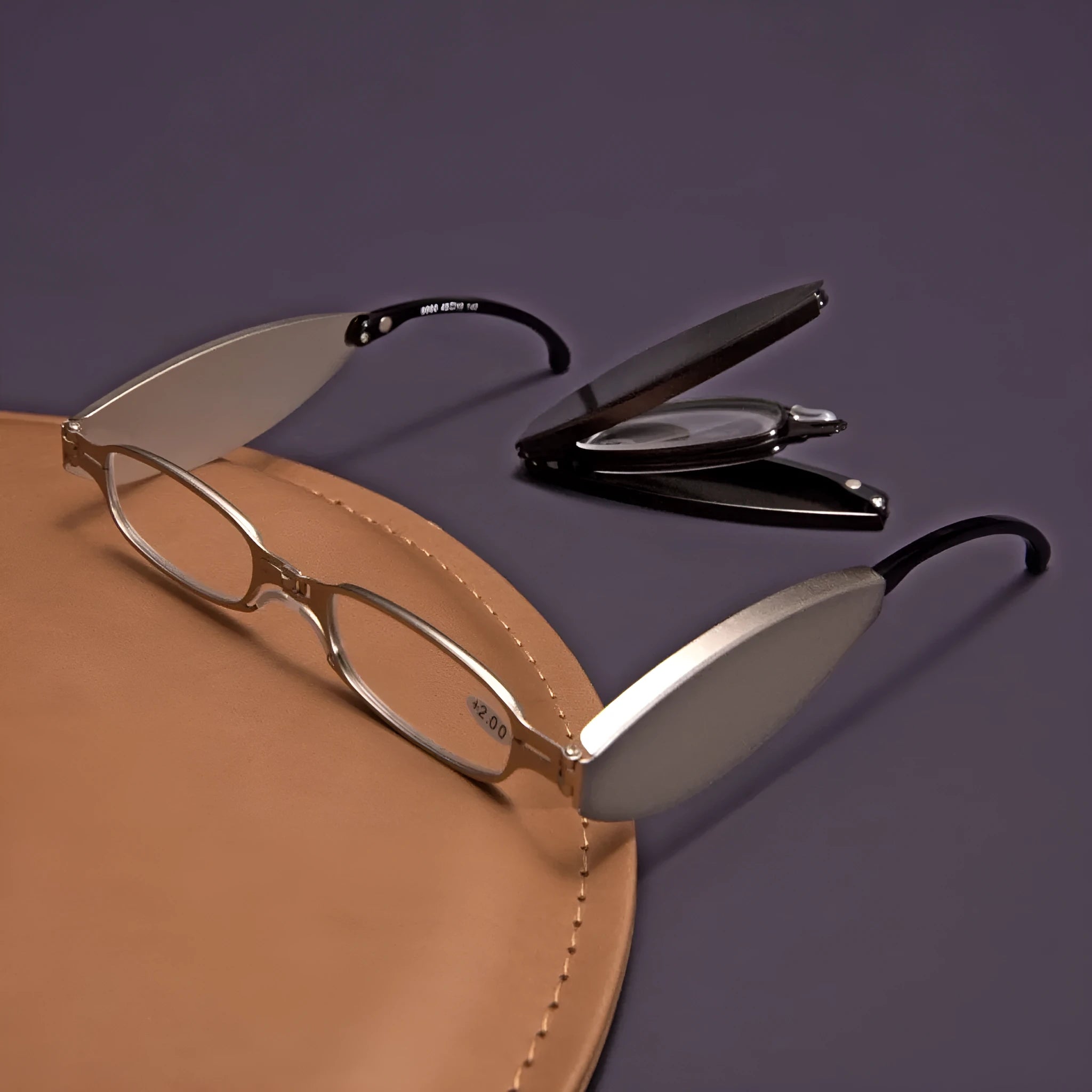 Black folding presbyopic glasses with retro ring-style frame, shown open and collapsed.