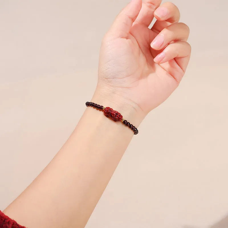 Women's garnet bracelet with purple sand pixiu carving and strawberry quartz square beads