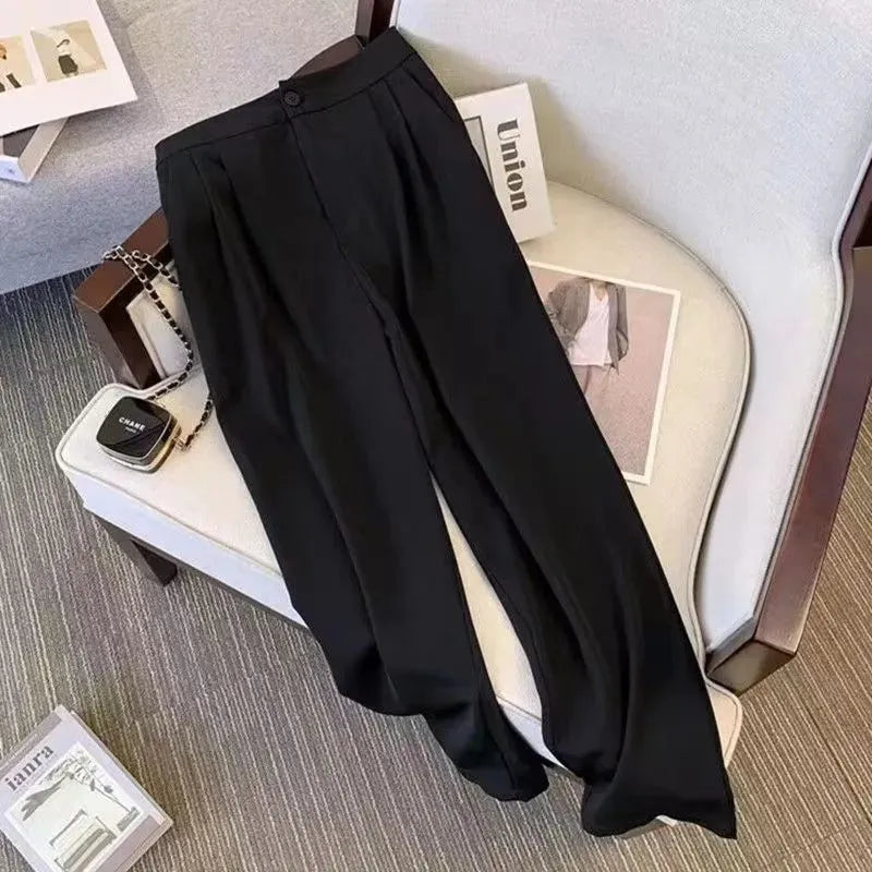 Women's loose fit polyester blouse in black, a slimming top for commute wear.
