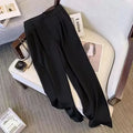 Women's loose fit polyester blouse in black, a slimming top for commute wear.