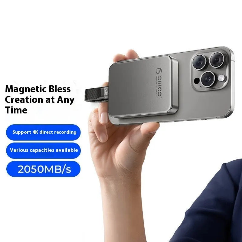Grey ultra-thin magnetic mobile solid state drive with C to C cable and magnetic ring on a white background.