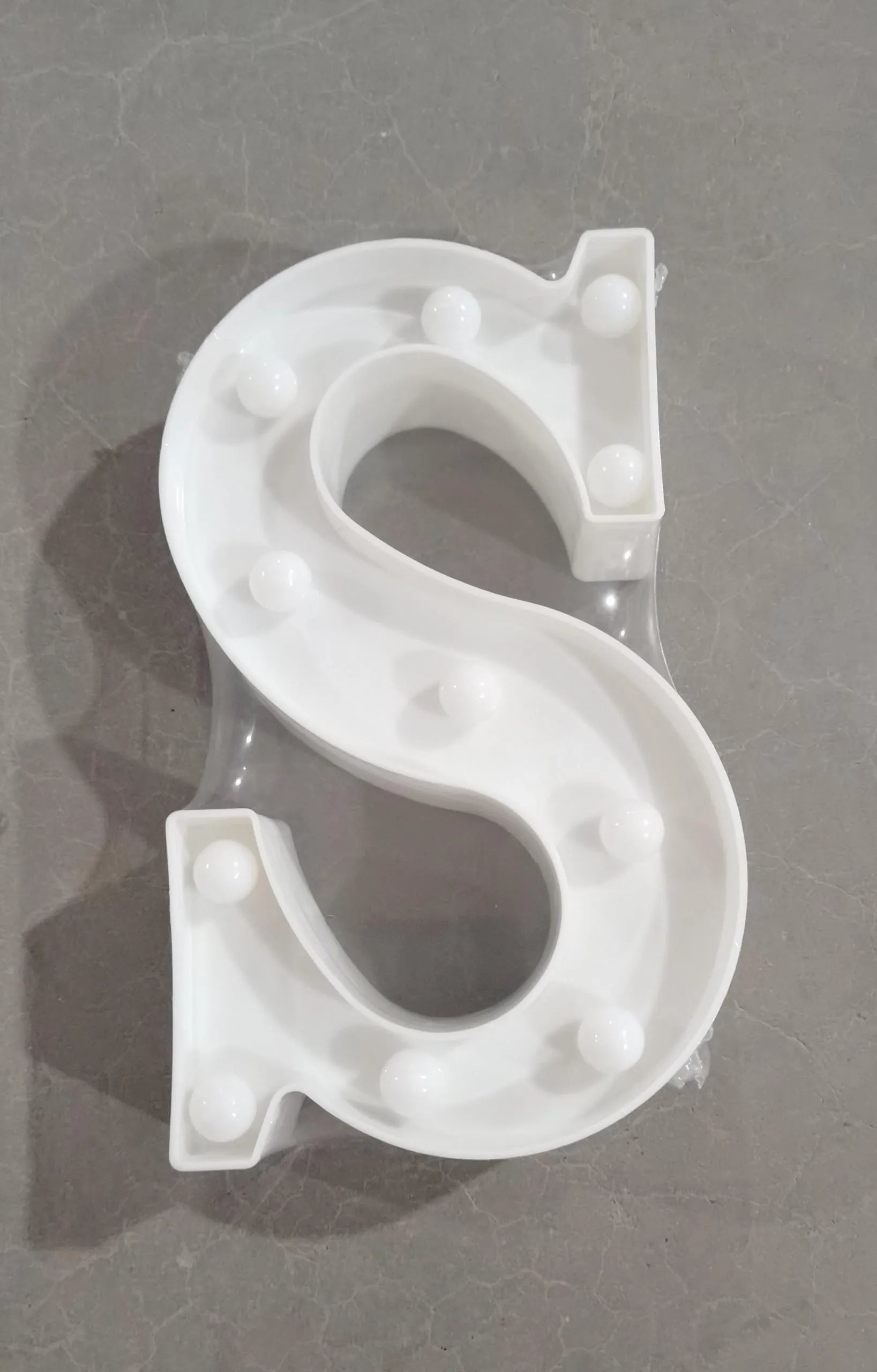 White plastic LED marquee letter sign with warm white glow, 22cm tall
