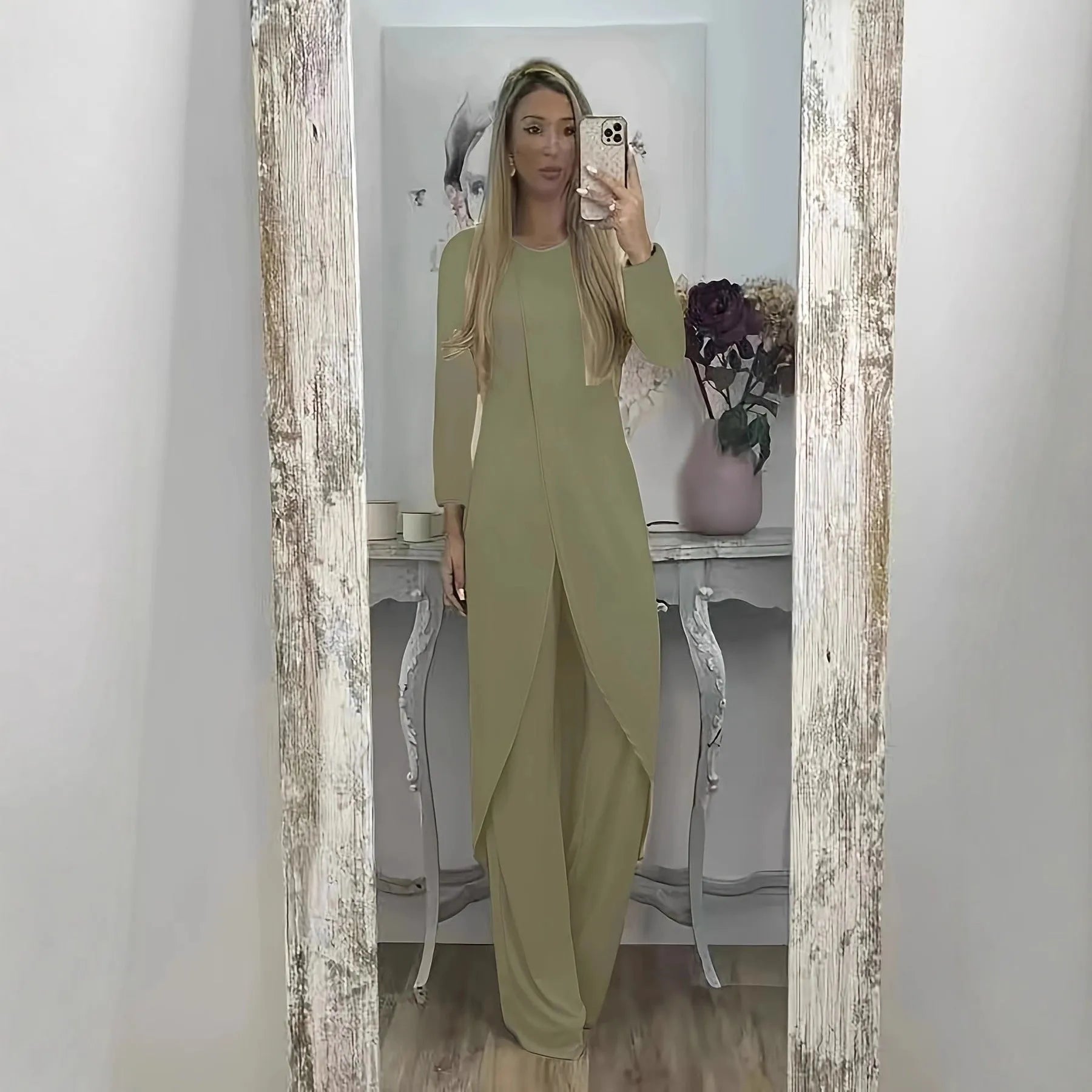 Casual long sleeve two-piece loungewear set in a neutral colour, showing the loose round neck top and matching trousers.