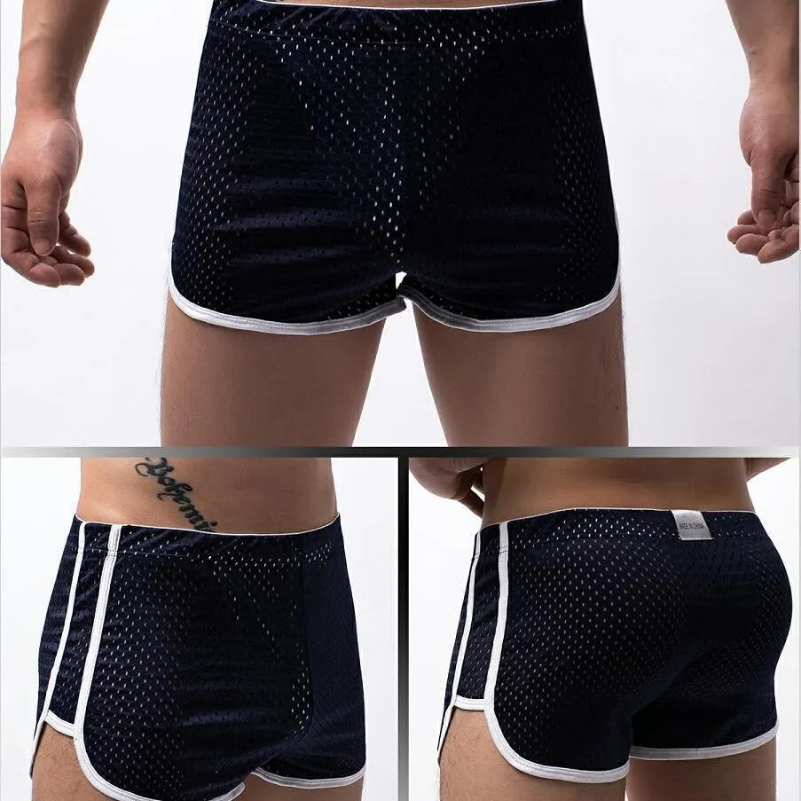 Men's black cotton blend boxer shorts with a mid-waist waistband laid flat.
