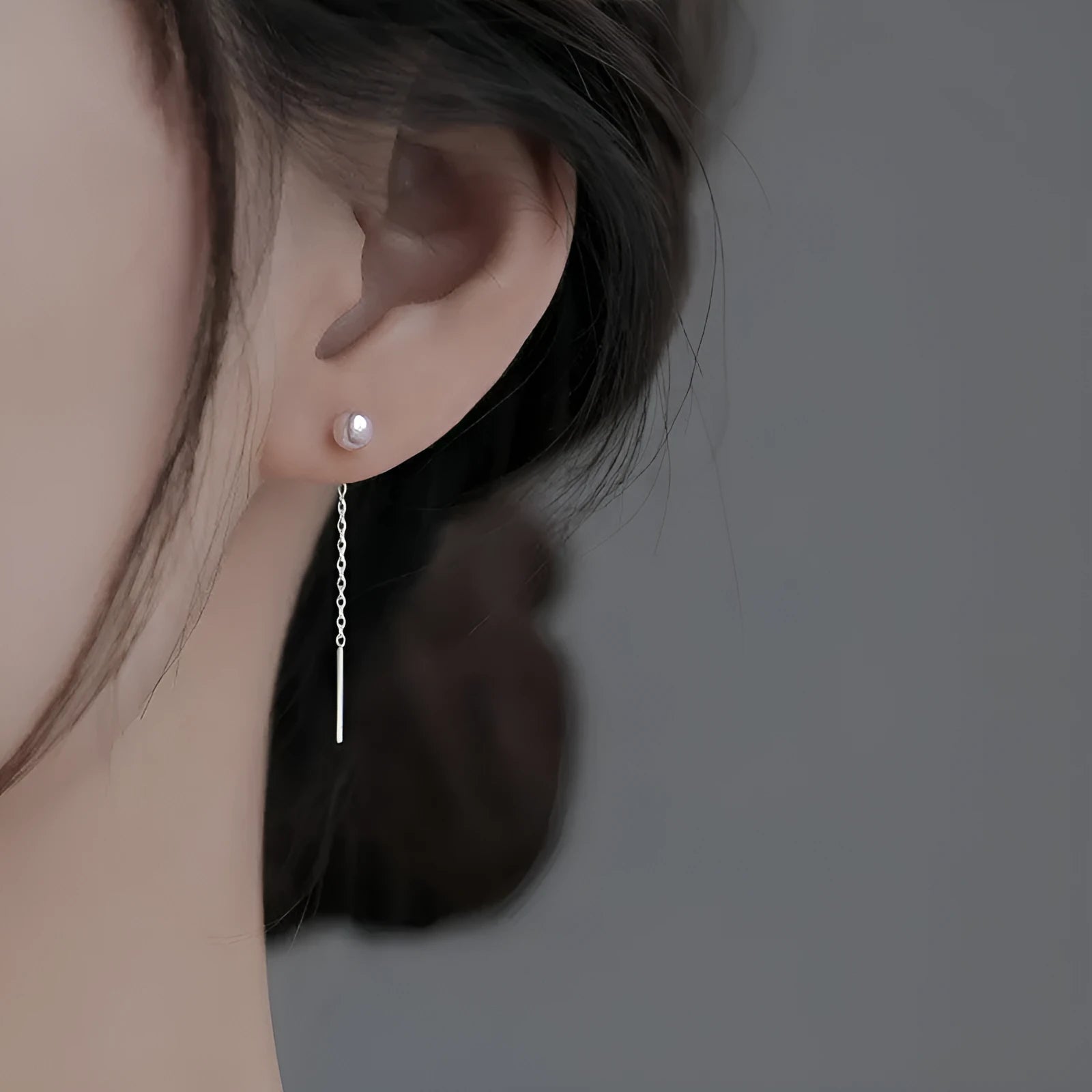 Sterling silver needle ear strings showing twelve hanging earring designs including pearls, clay balls, geometric shapes and zircon styles