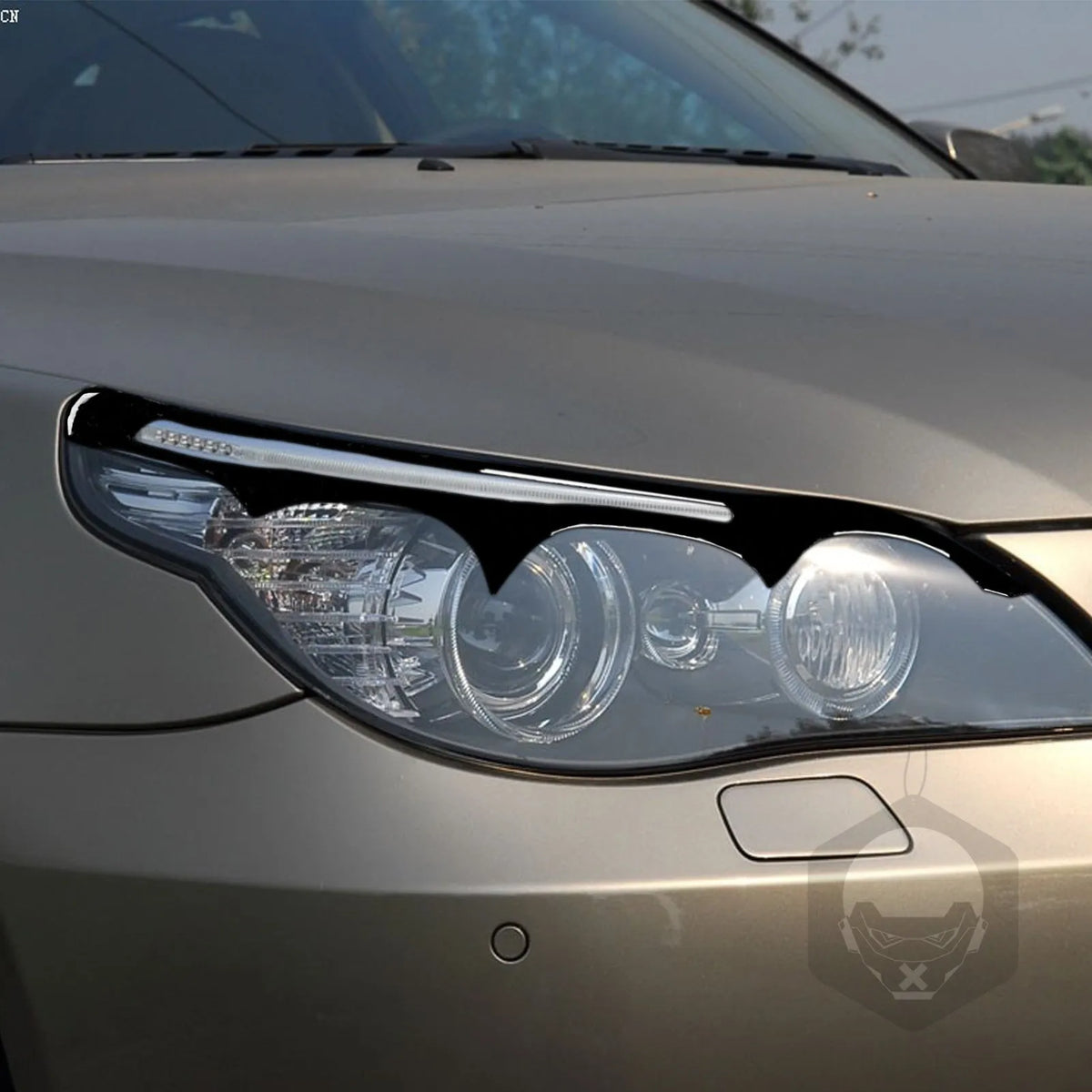 BMW 5 Series E60 front headlight with 3D decorative sticker in piano black finish