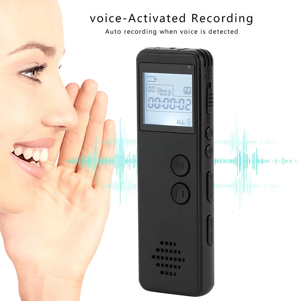 Black matte-finish MP3 digital voice recorder on a table showing its screen, recording button, and compact size.