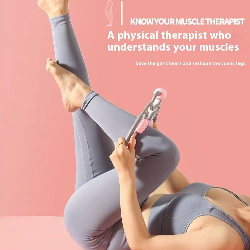 A pink manual leg massager roller with twelve wheels and black ring clips for securing to the leg.