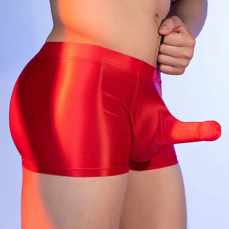 Men's seamless nylon boxer shorts in red, shown flat, featuring a mid-waist and animal print design.