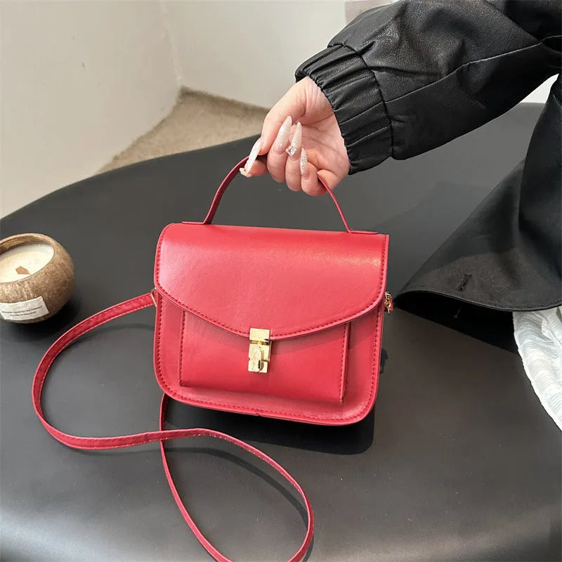 Retro style square messenger bag in PU leather, shown in black colour with visible sewing lines.