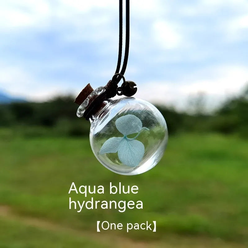 Glass car perfume pendant with preserved flowers for interior decoration and air freshening