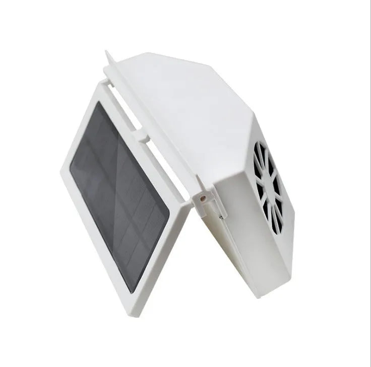 Solar car exhaust fan with three air outlets, black, mounted on a GM vehicle window with plastic strips