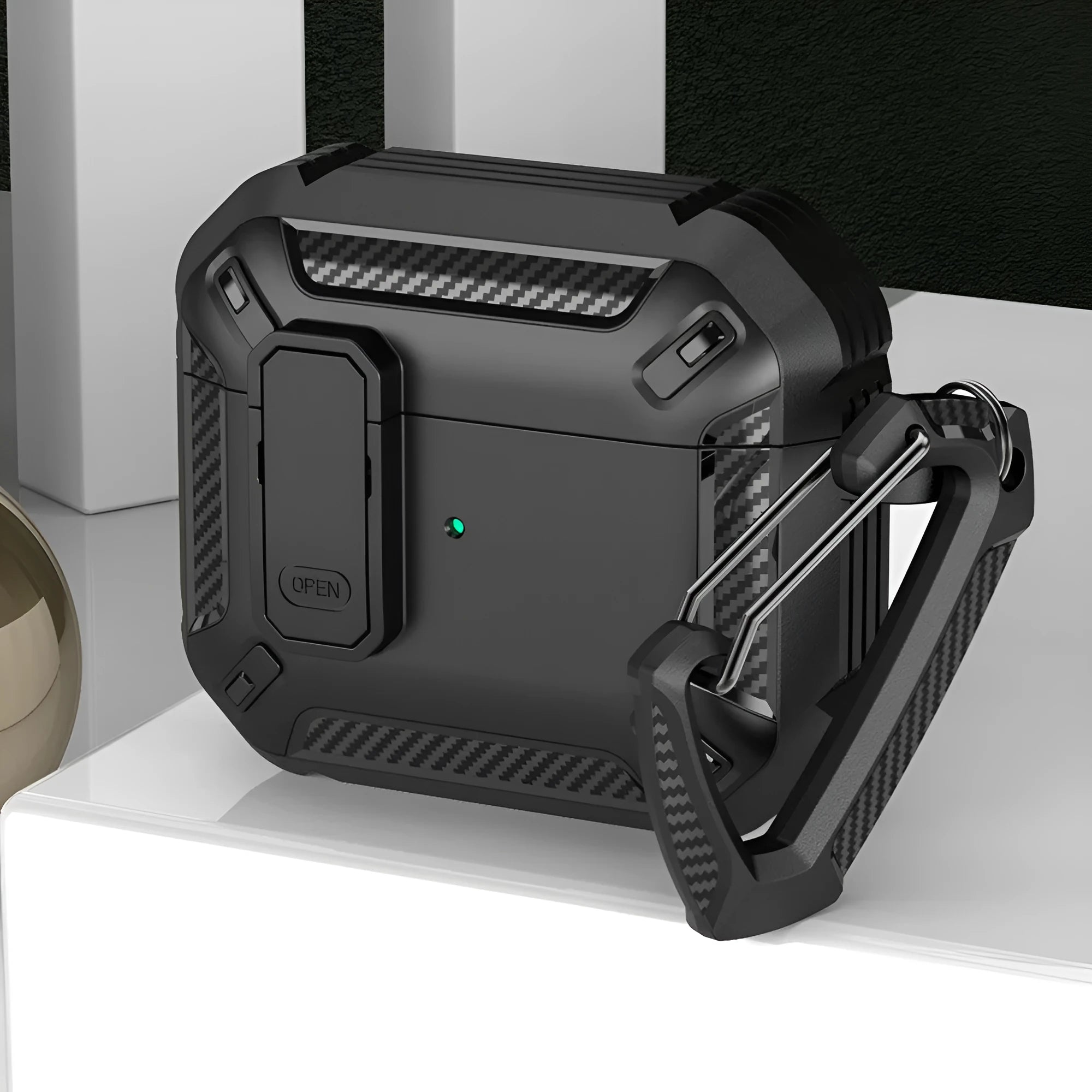 Two-colour plastic clamshell protective case for AirPods with a metal carrying hook attached.